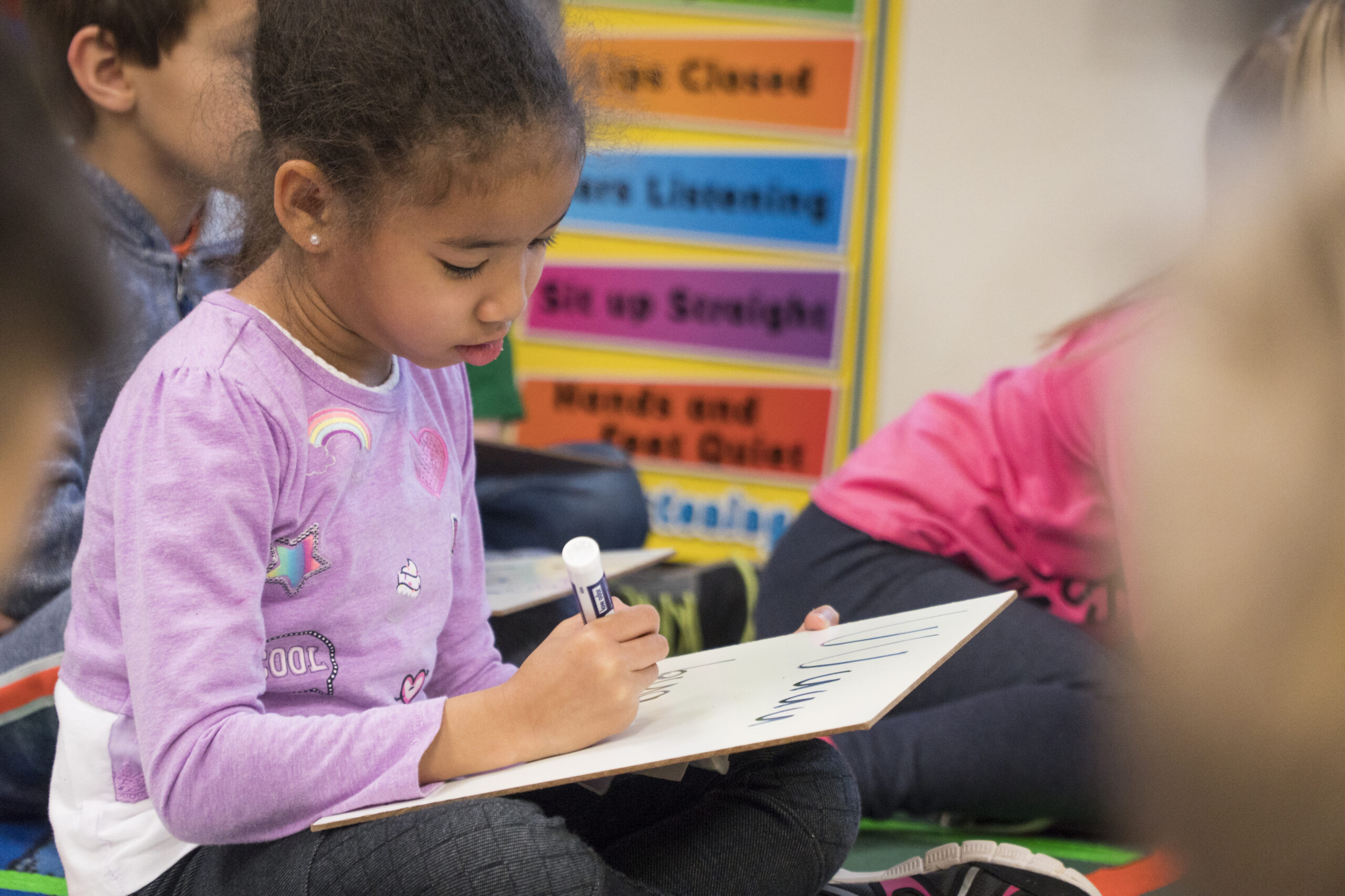 science of reading classroom student with whiteboard