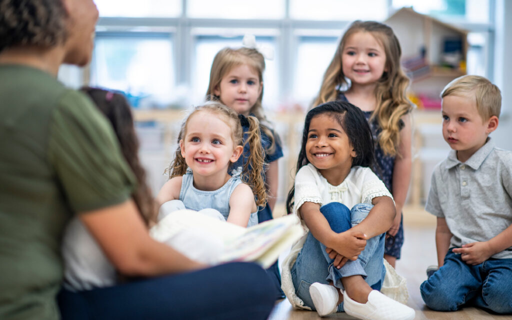 woman reading to young children